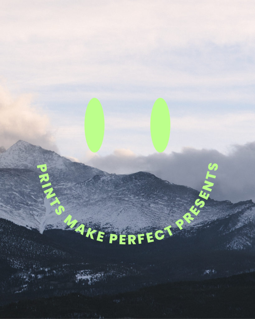 'print make perfect presents' smiley over a photo of a mountain