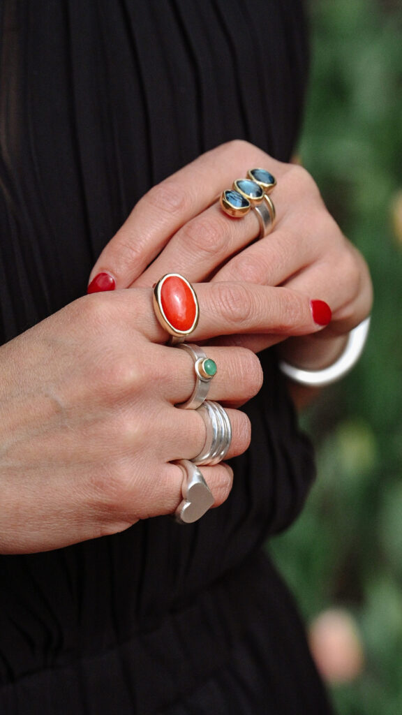Photo of lots of rings on a woman's hand